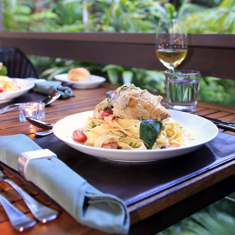 Delicious Creamy Tuscan Chicken served on the private deck of a Creekside Spa Cabin immersed in the rainforest of Northern NSW