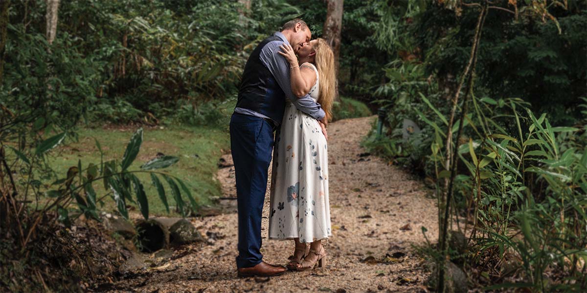 Byron and Carolyn kiss after their intimate wedding at Crystal Creek Rainforest Retreat near Byron Bay NSW