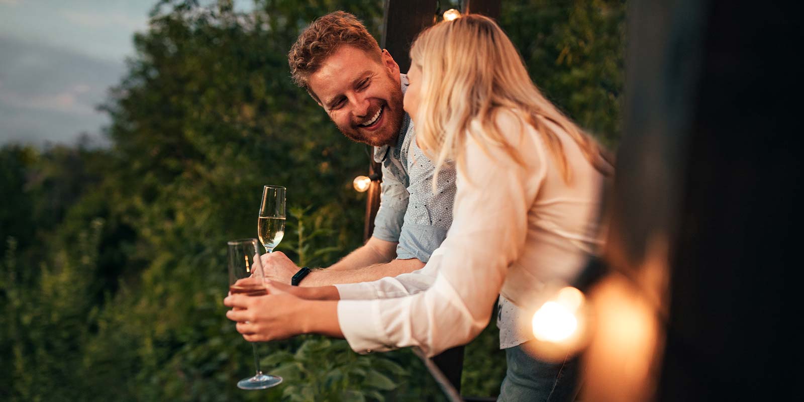 Couple enjoying an intimate, romantic evening overlooking the rainforest at Crystal Creek Rainforest Retreat